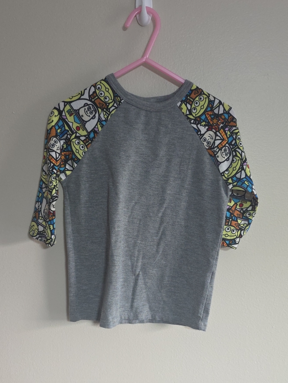 LuLaRoe Gray Raglan Tee with Colorful Character Print Sleeve